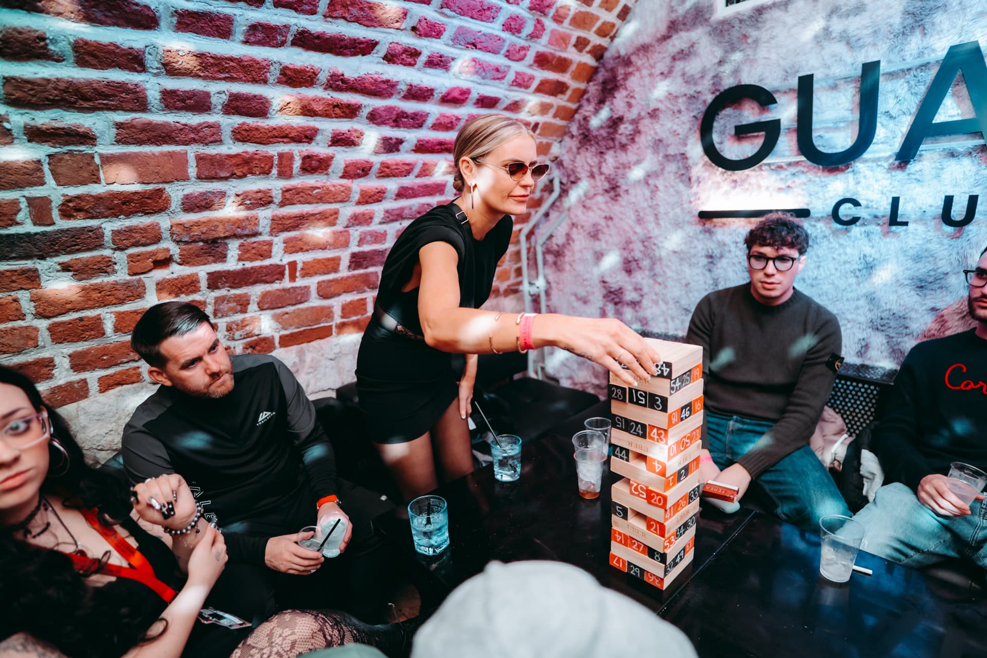 Crowd dancing on a packed Krakow nightlife dancefloor