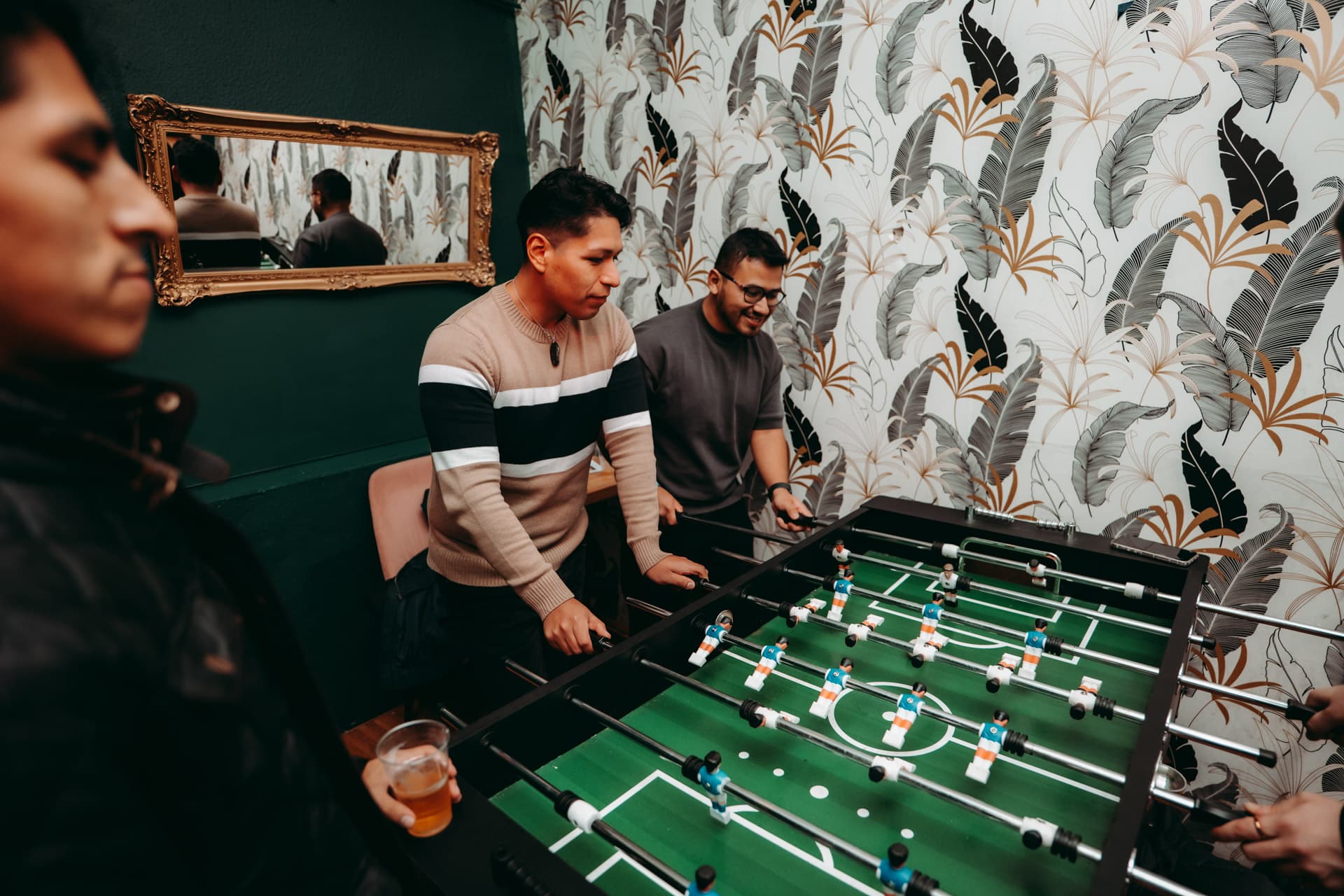Travelers playing foosball during Krakow Animals Crawl