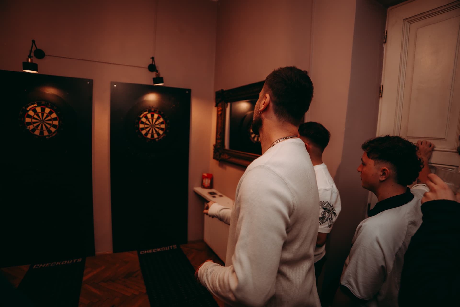 Guest throwing darts at a Krakow nightlife venue
