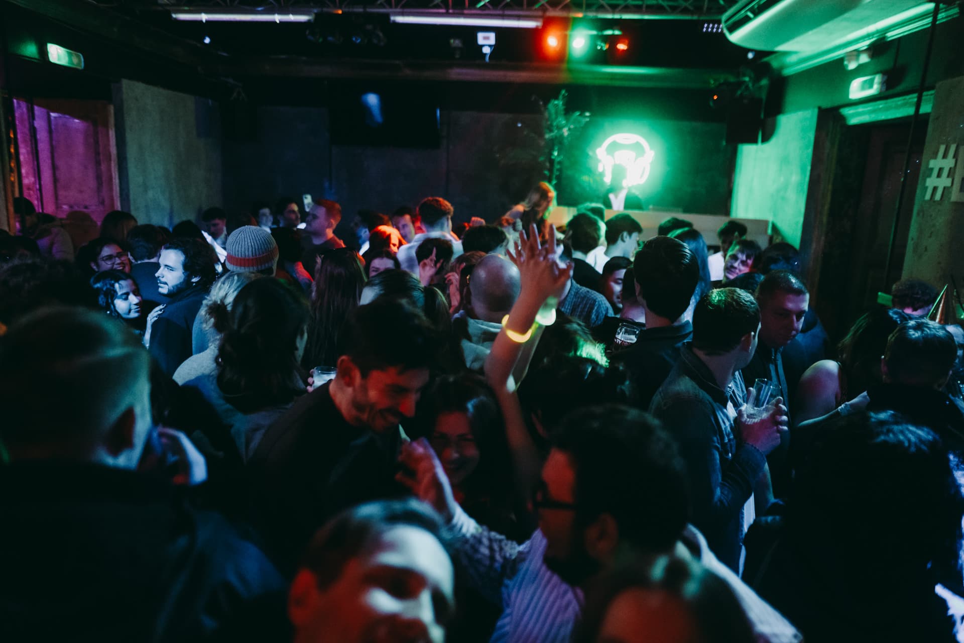 Friends laughing together on a Krakow pub crawl