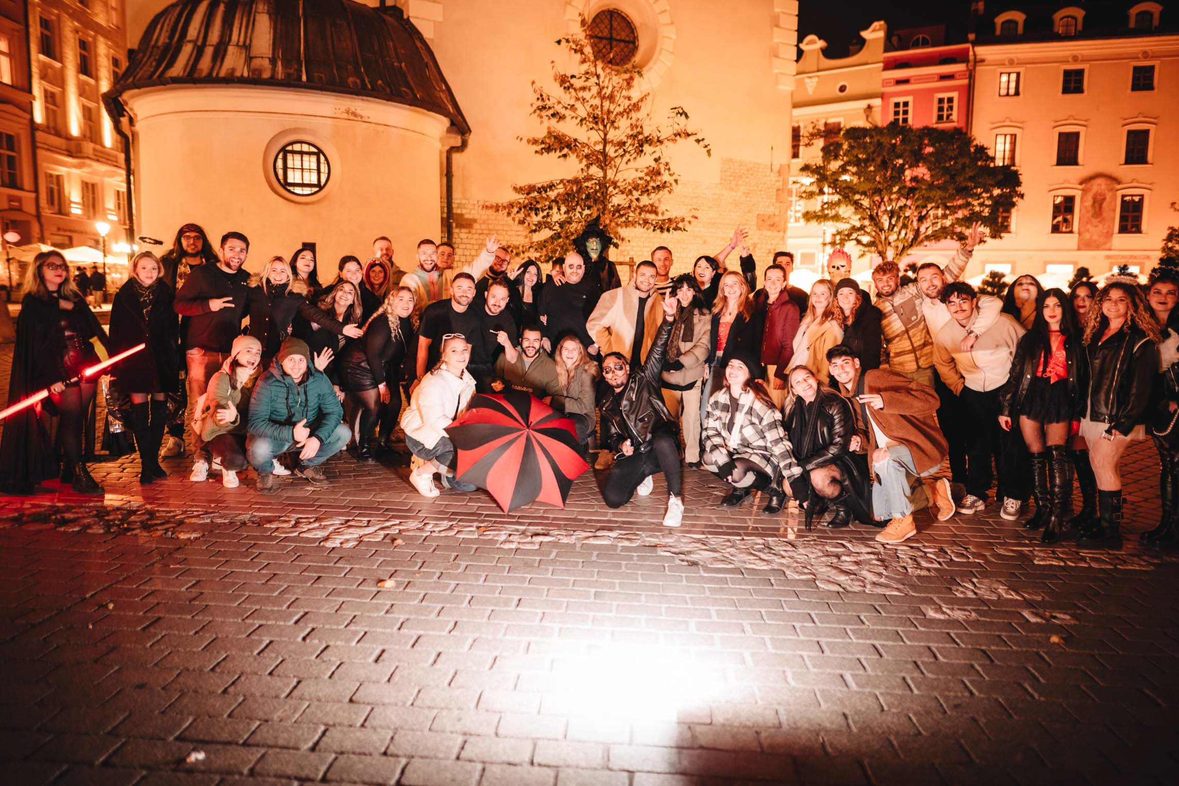 Halloween pub crawl guests meeting in Krakow Old Town