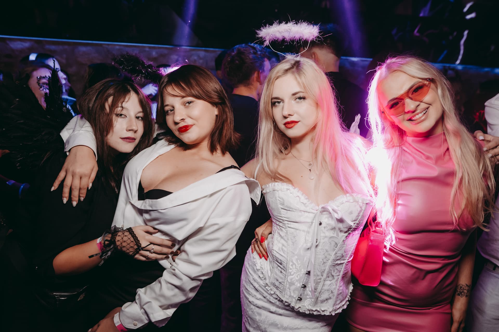 Friends dressed in angel costumes enjoying the Halloween club night