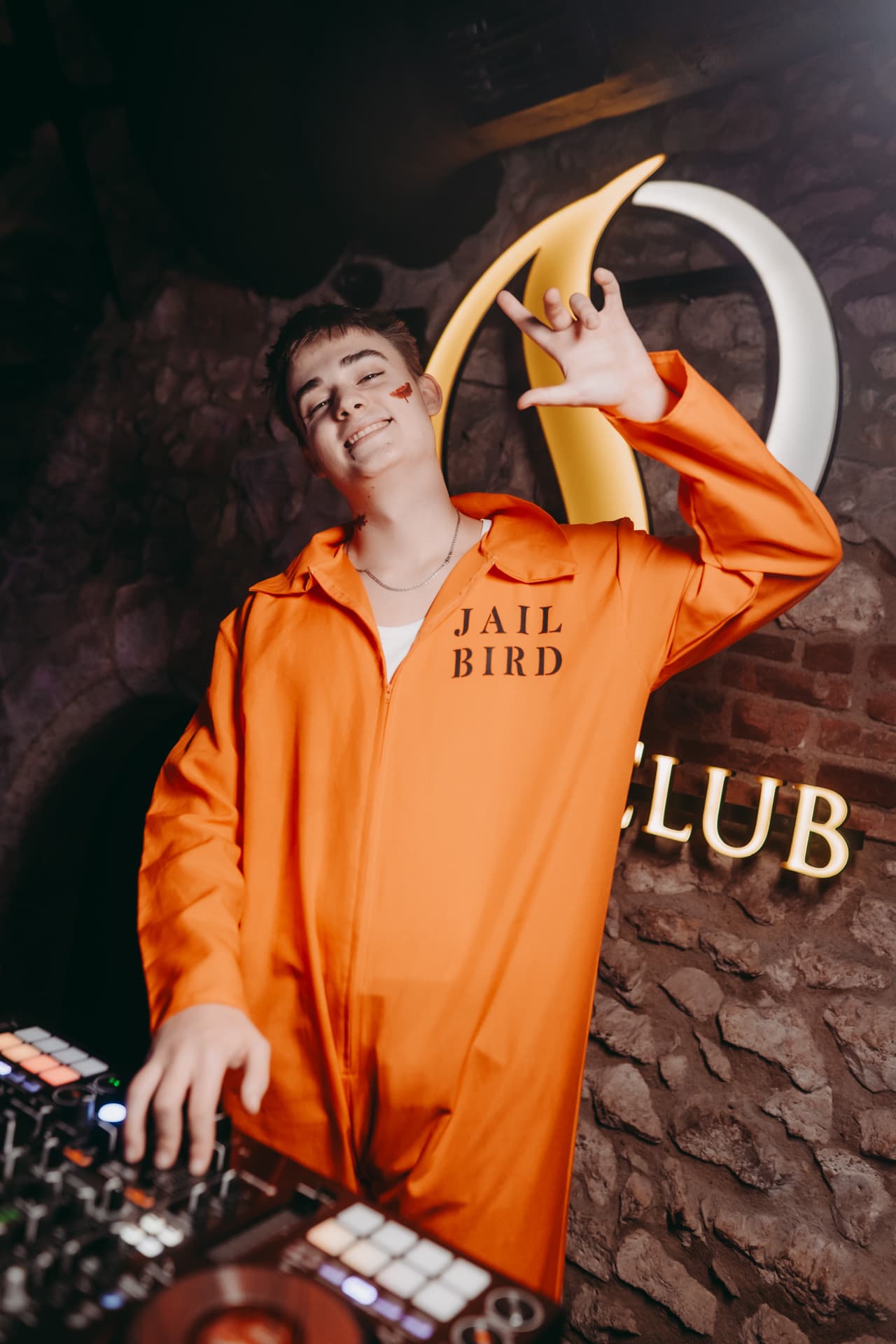 Halloween DJ dressed as a jailbird at the club