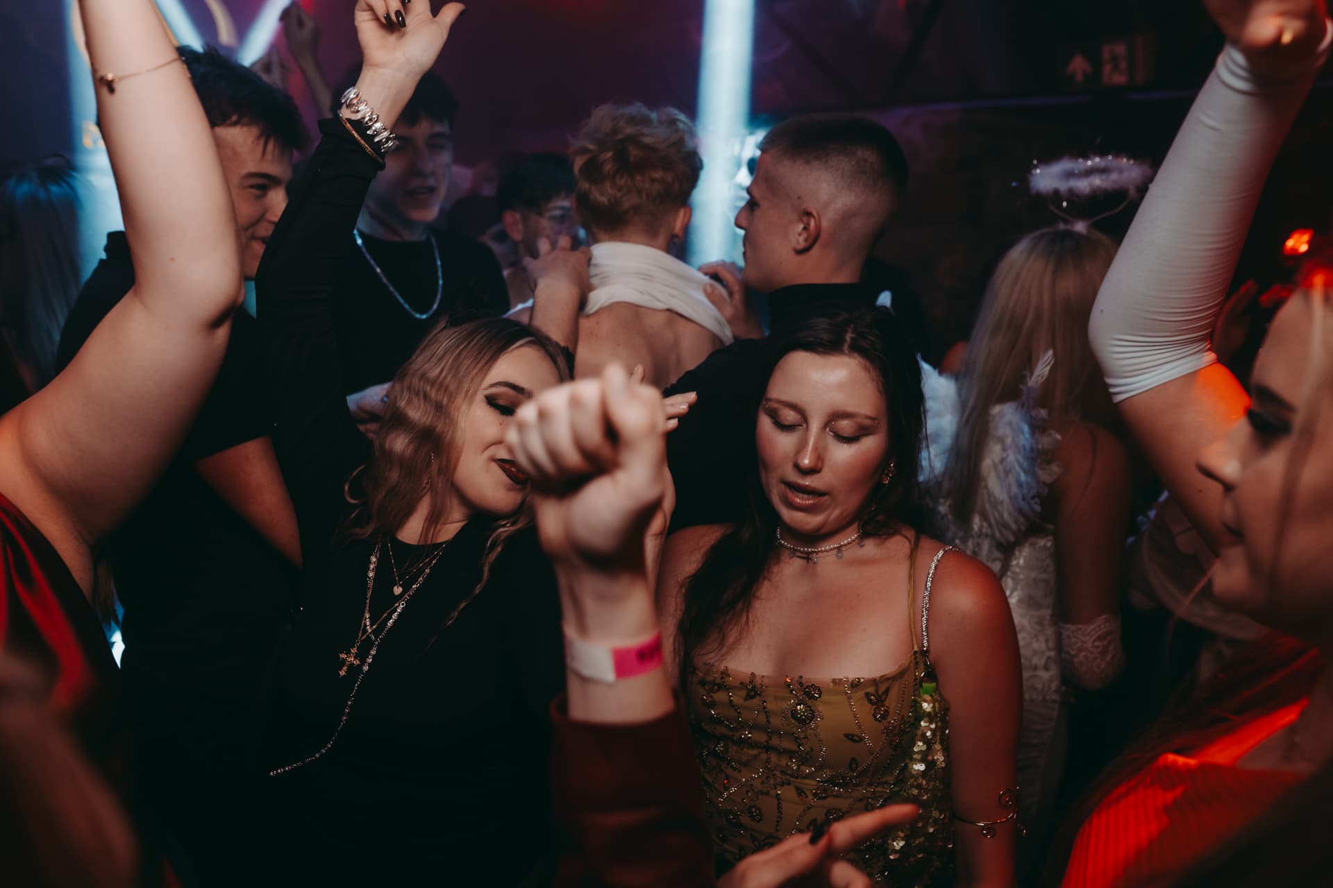 Halloween guests dancing together at the final club