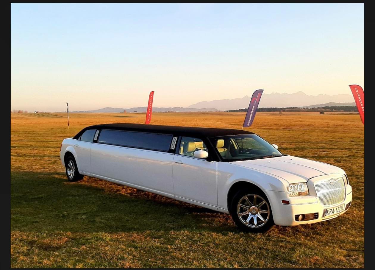 Private Chrysler-style party limo waiting in Krakow at night