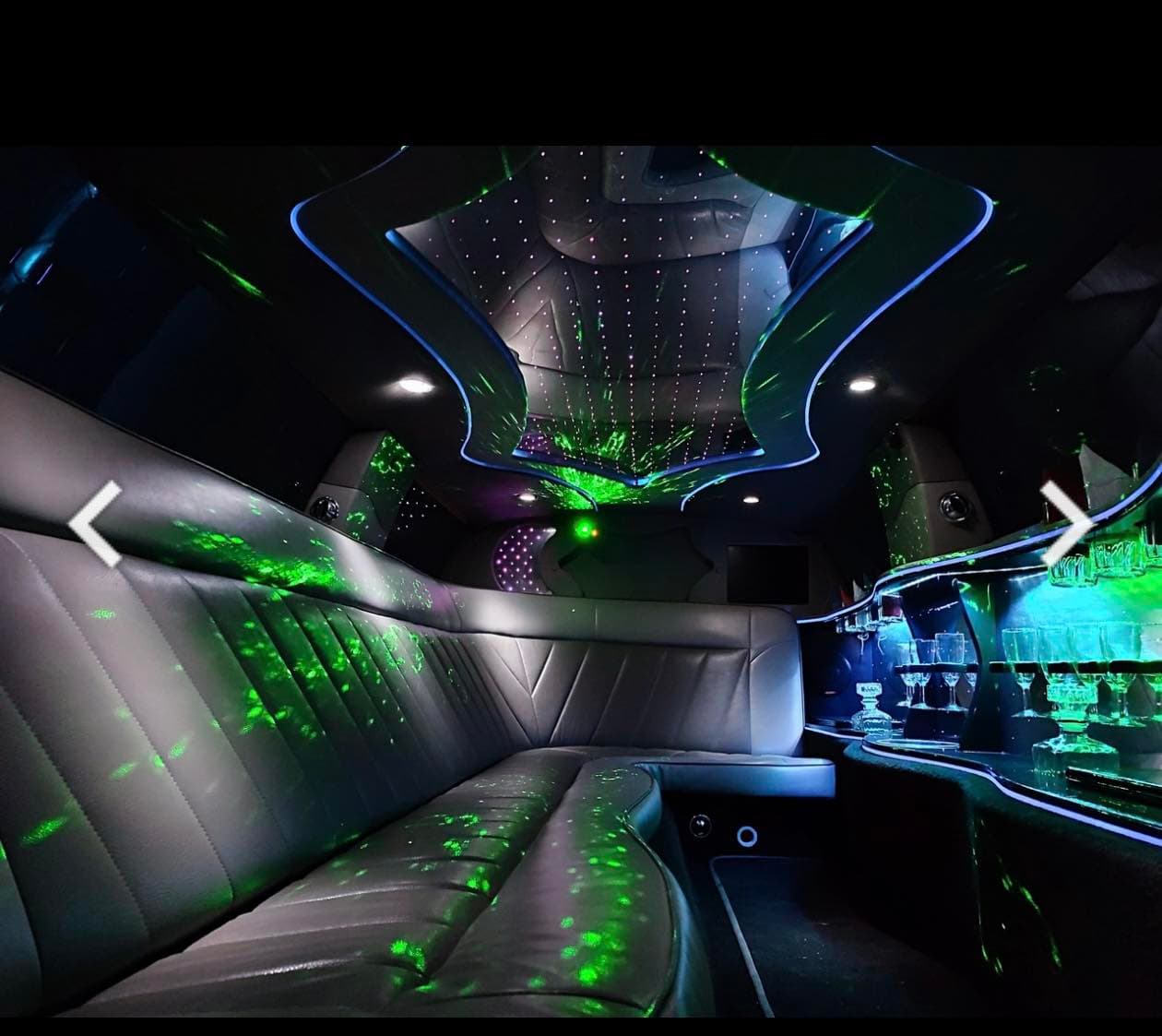 Green lighting inside a private Krakow party limo