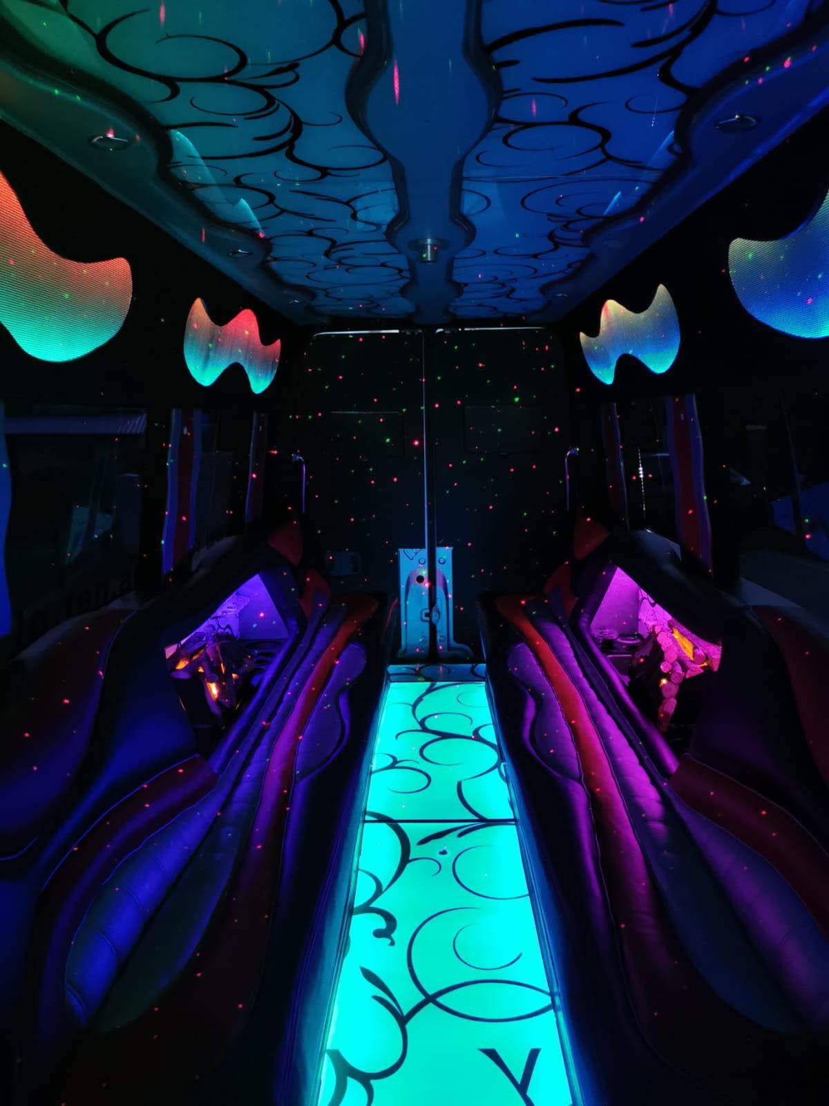 Blue party lights inside a private Krakow party bus