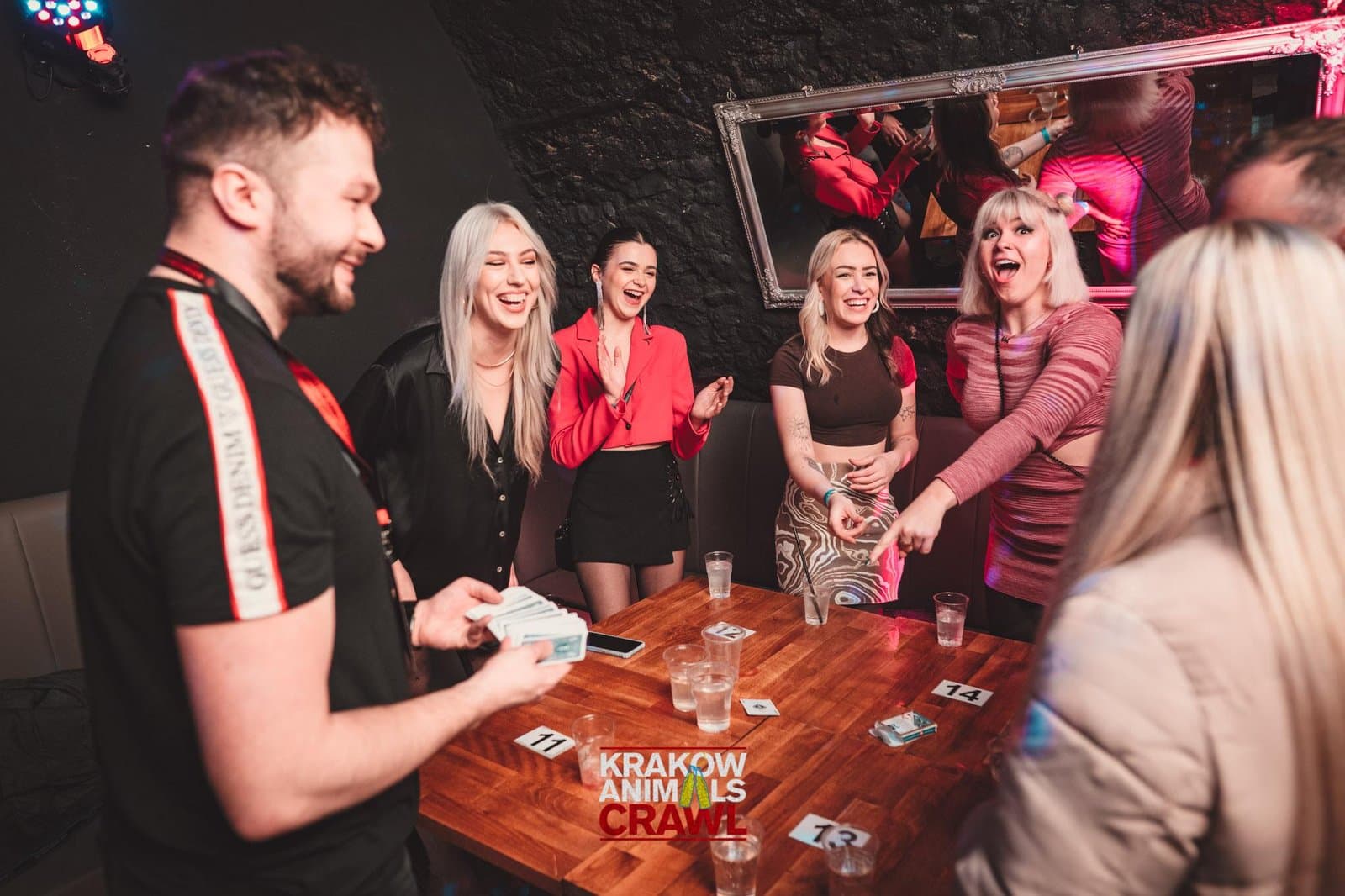 Guests playing King's Cup during the Krakow Animals Crawl opening games