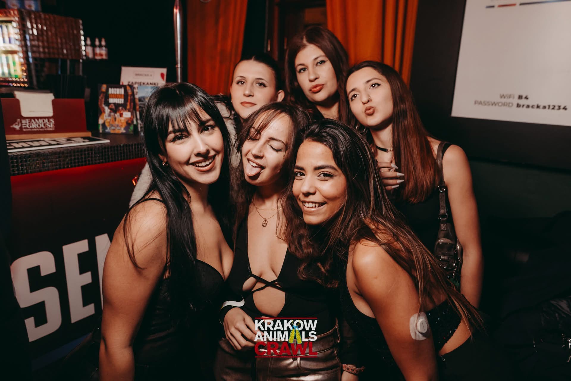 Friends smiling together during the Krakow party night