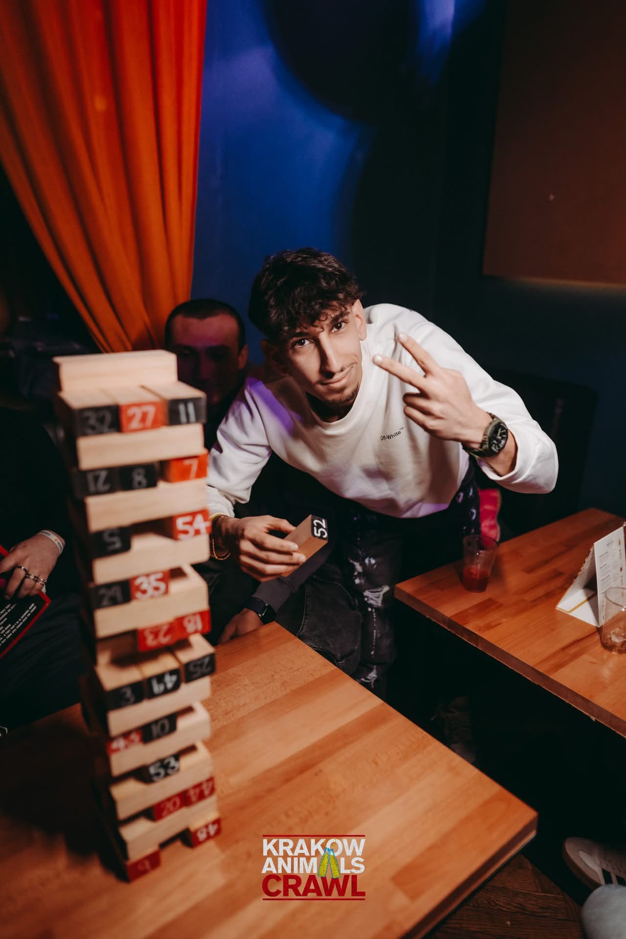 A guest playing a tower game during the opening party