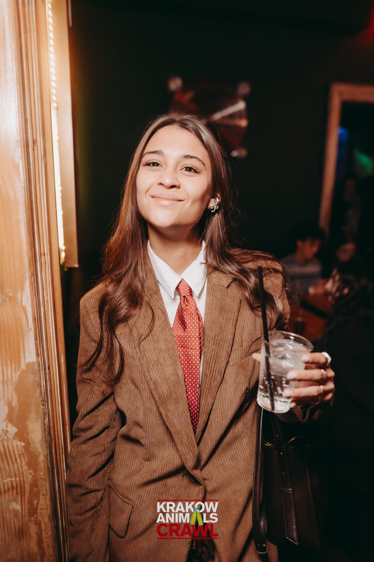 A dressed-up guest enjoying the Krakow party night